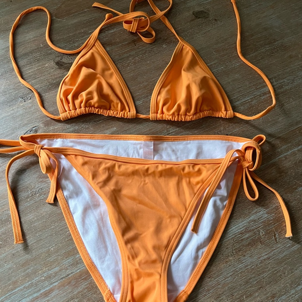 Victoria’s Secret String Bikini in Tangerine. Brand new, size Medium